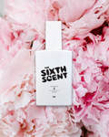 The Sixth Scent SI Signature perfume bottle with a sleek design and elegant packaging on a neutral background.