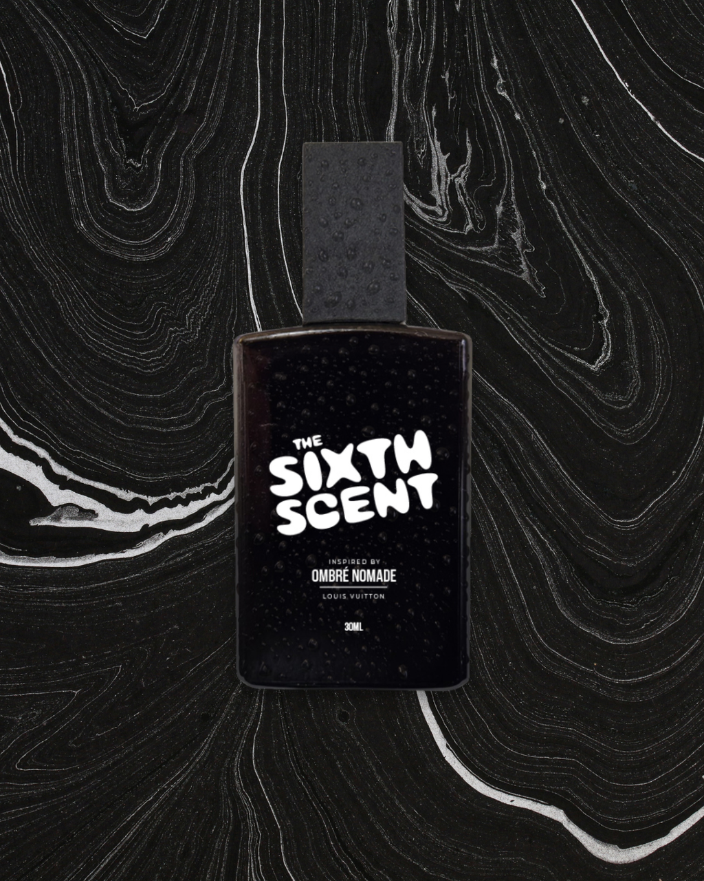 A bottle of NOMAD OUD perfume by The Sixth Scent, showcasing its elegant design and luxurious fragrance packaging.